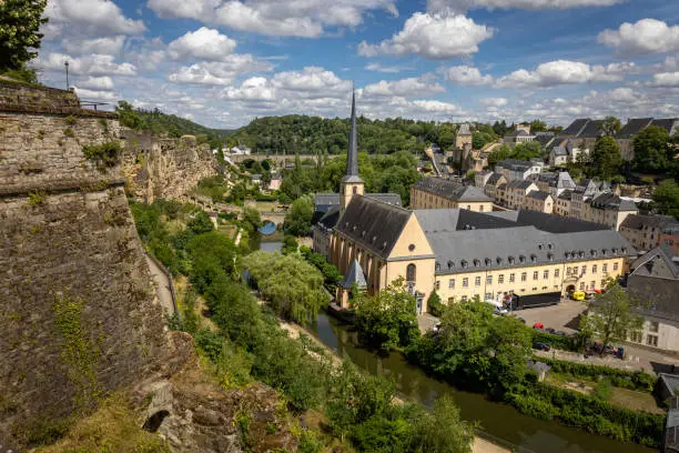 View of the centuries-old casemates of Luxembourg, an underground military fortress belt and the abbey of Neumunster, surrounded by the beautiful old buildings of the city