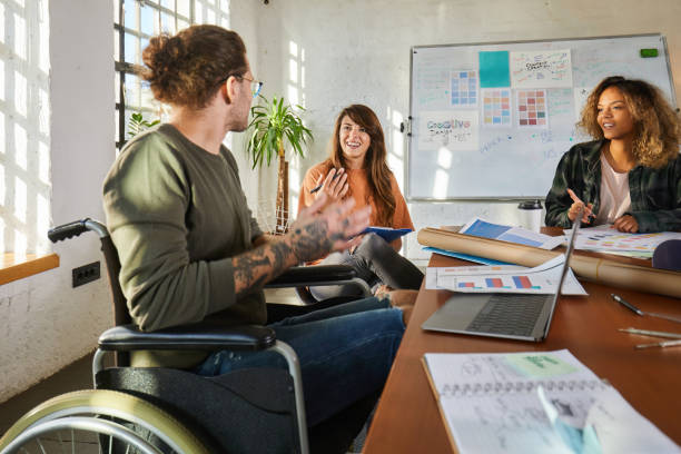 istock Disabled businessman having a meeting with his colleagues. 1703599877