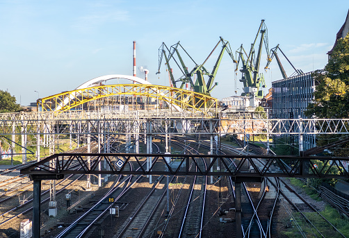 Shipyard in Gdańsk, Poland. Railways and cranes in the harbor view from the bridge. Rails.