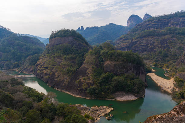 Viewpoint at heavenly tour peak in Wuyishan park with a river bend, sunset, copy space for text