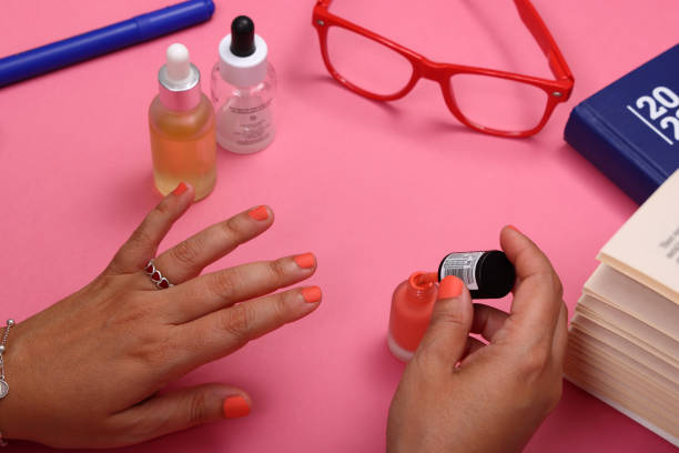 Painting fingernails on print paper