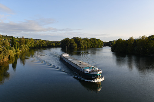 Saint-Germain-en-Laye, France-09 23 2023: Barge on the Seine river near Saint-Germain-en Laye, France.