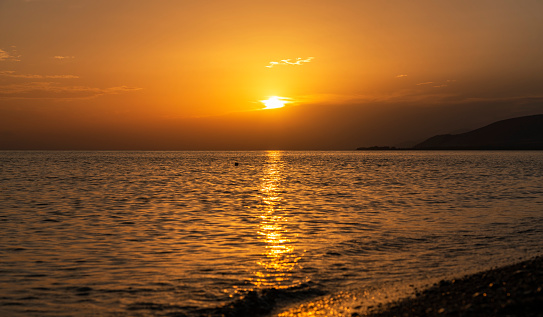 Beautiful orange sunset,Sun rays on the lake,Armenia,Lake Sevan