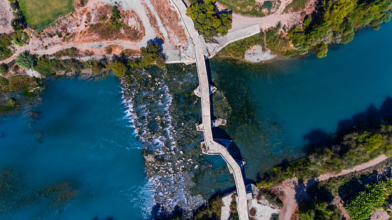 Stoned bridge with water flowing in the river. (Belkıs Sultan Alaeddin Bridge) Turkey