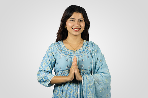 Young Smiling Asian Nepali Indian Housewife giving several best gestures  and poses with greeting