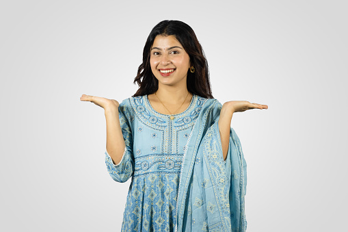 Young Smiling Asian Nepali Indian Housewife giving several best gestures  and poses with greeting