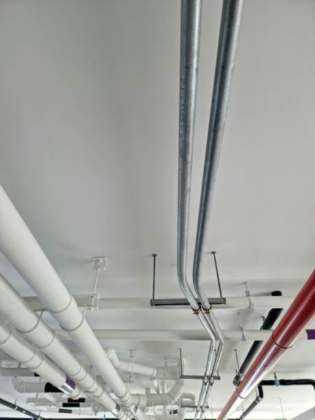istock Pipes under the building for drainage systems and electrical pipes. 1703708751