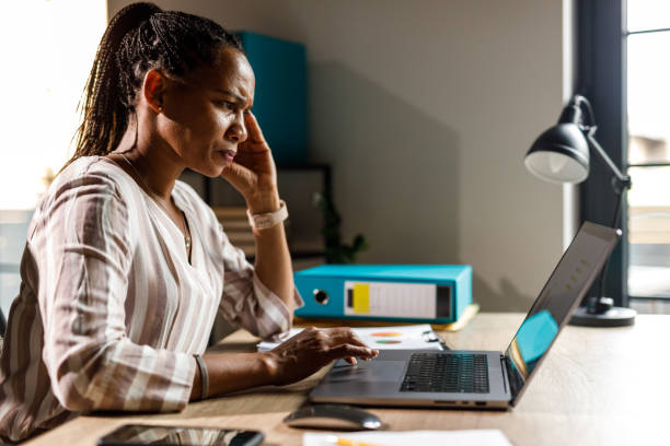 istock Frustrated businesswoman struggling with workload 1703726285