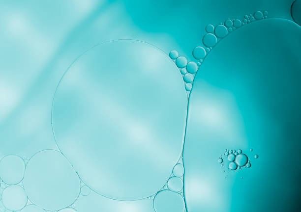 istock Art image of oil and water bubbles background. 1703728496