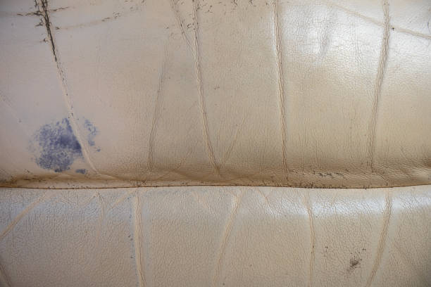 Beige classic leather  textured background. Classic Ivory beige upholstery leather chair textured background. fake leather stock pictures, royalty-free photos & images