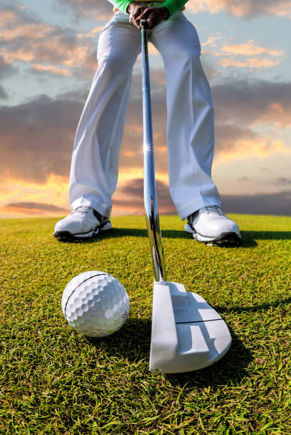 istock Man playing golf against colorful sunset 1703764306