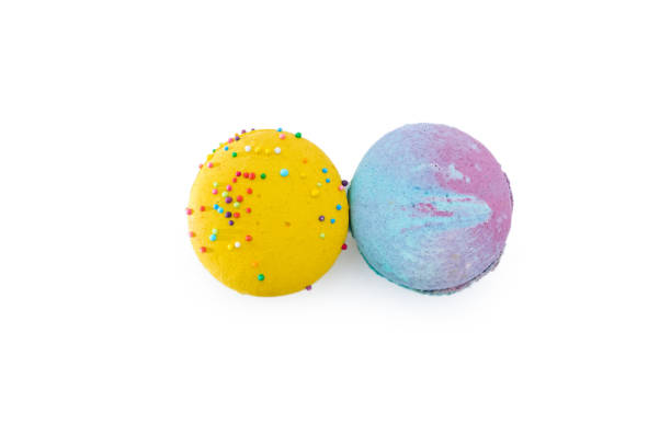 istock Sweet colorful macarons isolated on white background. Tasty colourful macaroons. Two multi-colored blue and yellow macaroons. French pastry made from egg whites. 1703789896