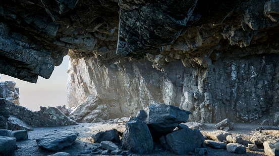 The stone floor of the rocky cave is bathed in the warm daylight, casting a tranquil ambiance within.