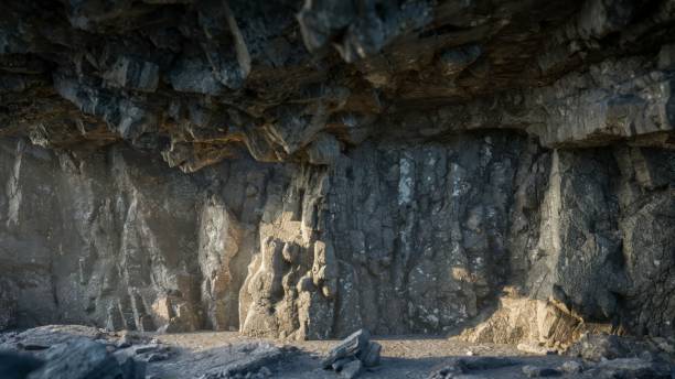 istock cave's rocky ceiling allows the warm, golden light 1703792626