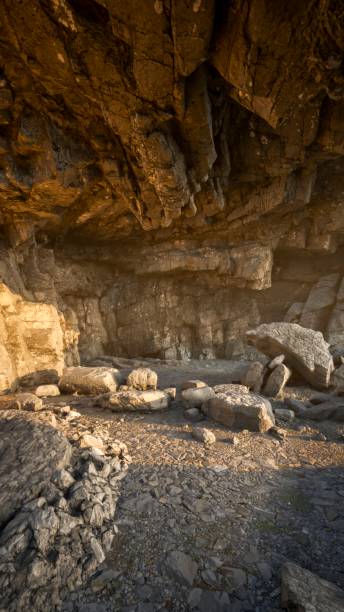 istock The cave floor is bathed in the light of the setting sun. 1703793766