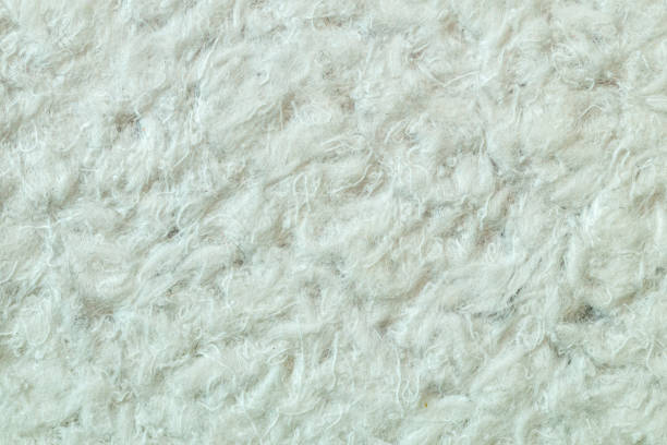 istock Cotton plaster wall . Abstract interior wall decor background. cotton wall coating. Abstract textured liquid wallpaper. Decorative wool plaster texture. cotton decorative plaster to cover wall surface. Moisture regulating 1703806516