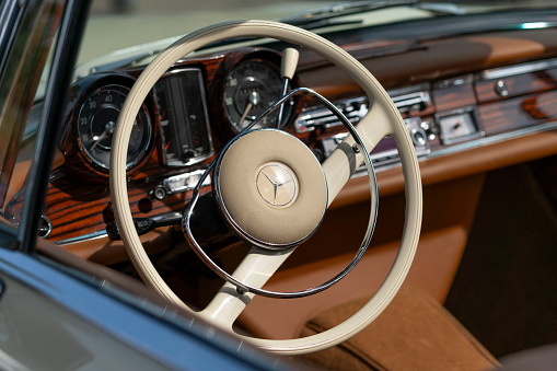 Close-up of a vintage pickup's chrome wheel.