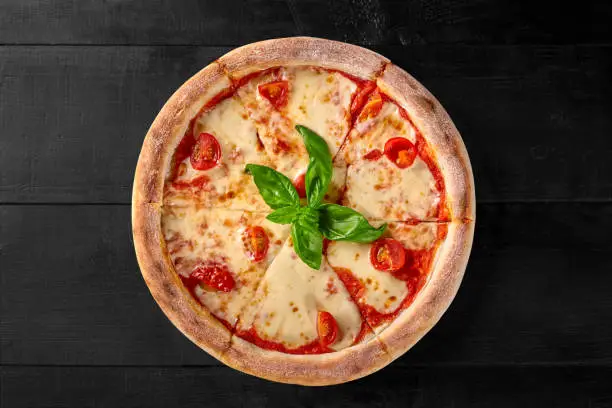 Photo of Pizza Margherita with pelati sauce, mozzarella, tomatoes and basil