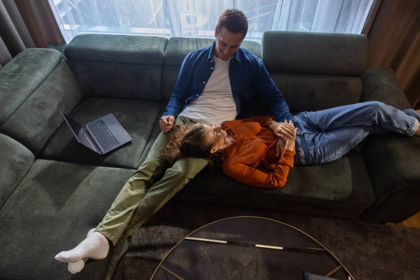 istock Couple relaxing at home 1703812654