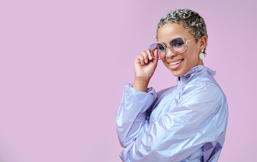 Fashion, sunglasses and black woman in vaporwave jacket on pink background in studio mock up space advertising and marketing. Gen z girl or young and model with retro or vintage style portrait mockup