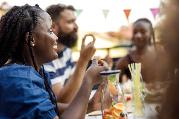 istock Friends snacking on delicious foods, chatting and bonding 1703827933