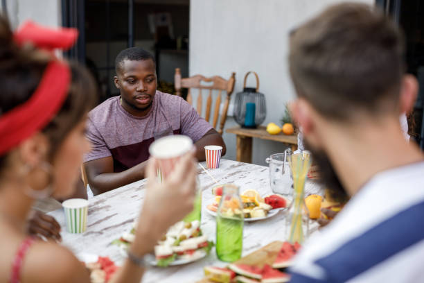 istock Friends enjoying refreshing drinks and snacks during a relaxing party on the balcony 1703827996