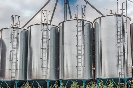 Closeup shot of four grain silos