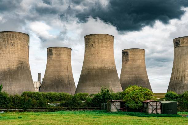 istock Power plant with cooling towers 1703843941