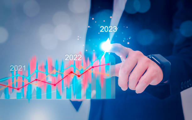 istock Businessman holding tablet with growing virtual hologram of statistics, graph and chart 1703852849