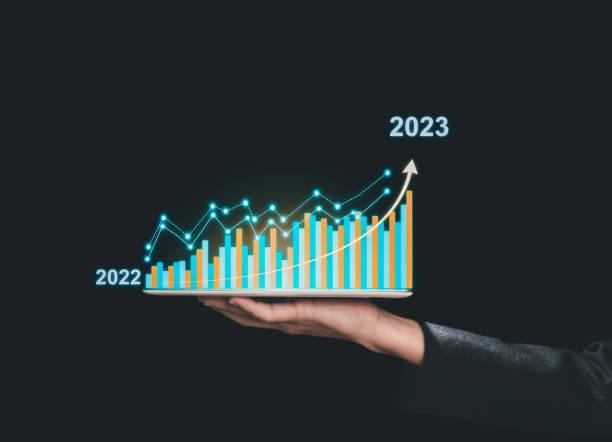istock Businessman holding tablet with growing virtual hologram of statistics, graph and chart 1703862170