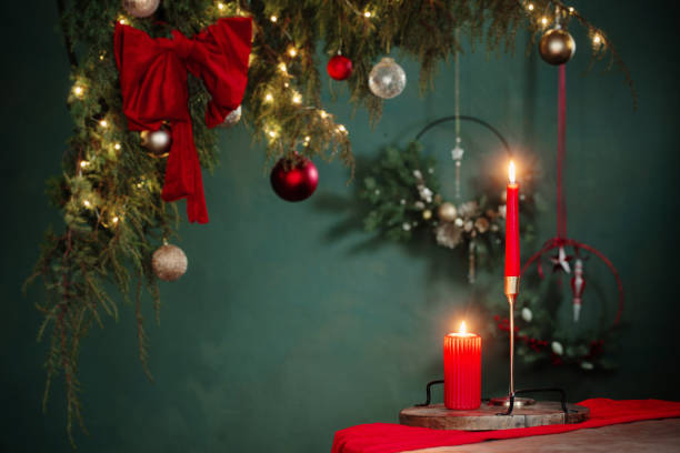 istock red  and golden christmas decor on table on dark background 1703884885