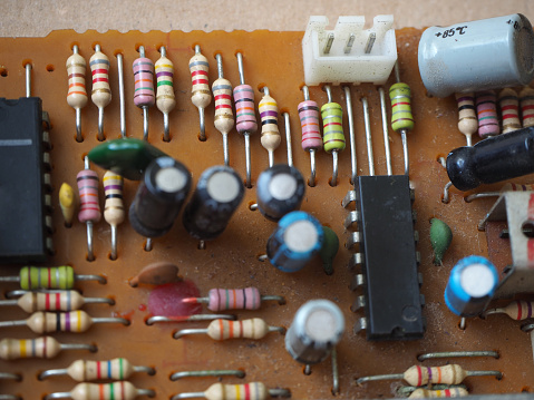 Resistors of different ohm values on the electronic circuit board. Selected focus.