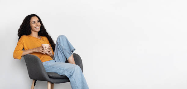 istock Relaxed young middle eastern woman drinking tea, copy space 1703935332