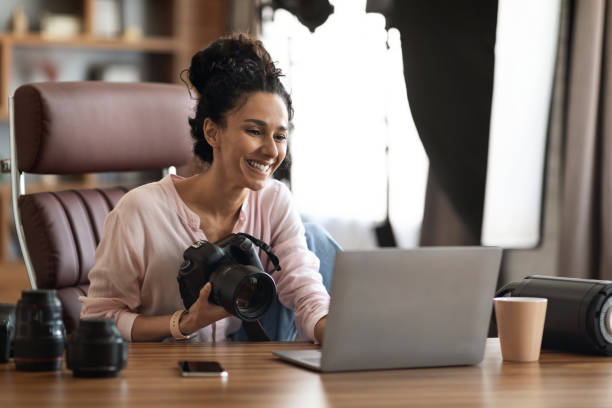 istock Creative millennial lady photographer enjoying her job 1703937176