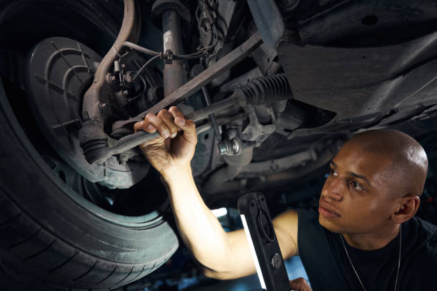 istock Anxious auto-mechanic suspecting problem in hubs and axle 1703942874