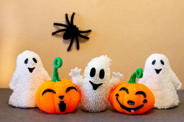 istock Jack-O'-Lantern pumpkins, spiders and ghosts for trick or treat on Halloween. 1703945256