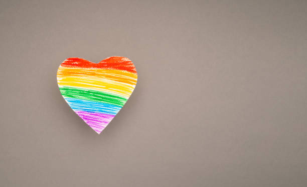 istock A rainbow heart made from paper on a gray background 1703969357