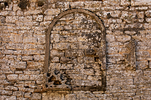 old bricked-up window in a BC temple. architecture and travel