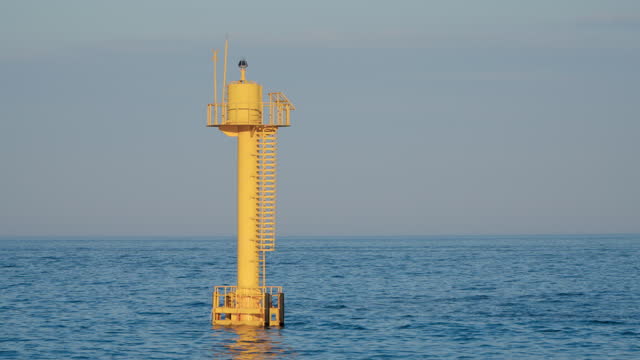 Yellow Buoy In The Ocean During Daytime. - wide static