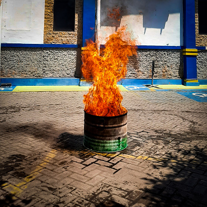 A flame is a phenomenon that occurs when a material reaches its flash point and reacts chemically with oxygen in the air.  A flame produces heat, light, and combustion products such as smoke, water vapor, and gases.  Flames have different colors depending on the fuel, oxygen, and temperature involved in the combustion process
