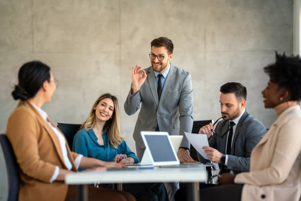 istock Successful business professionals presenting analytical report, working together in corporate office 1704050786