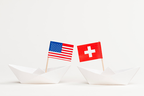 American and Swiss Flag on the paper boats.