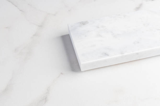 istock Blank white marble podium platform or pedestal on marble background for product display. Empty stands for showing or presenting products. 1704102484