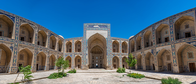 Mosaic wooden ceiling and carved columns in the courtyard of the Sheikh Bahouddin Nakshbandi memorial in Bukhara in Uzbekistan.