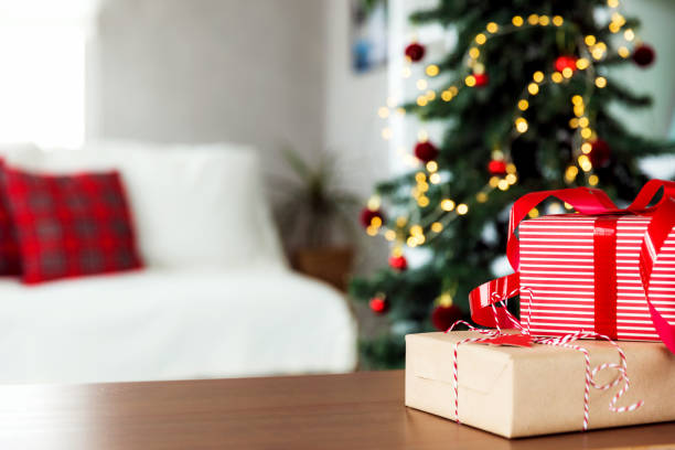 istock Christmas, New Year background. Empty wooden tabletop with bokeh fir tree, gift 1704148171