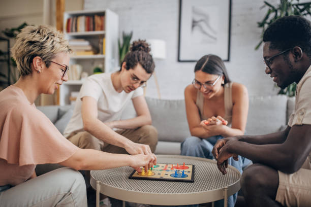istock Friends playing board game at home 1704156978