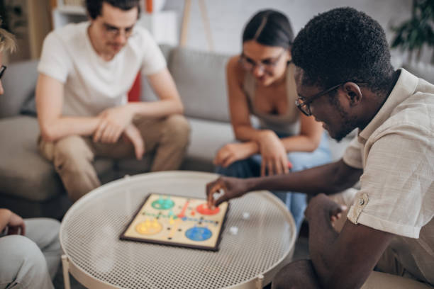istock Friends playing board game at home 1704158180