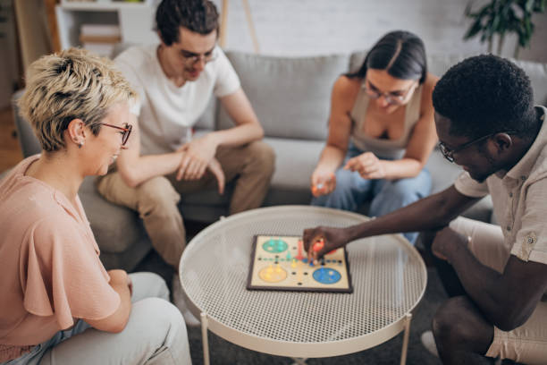 istock Friends playing board game at home 1704158744