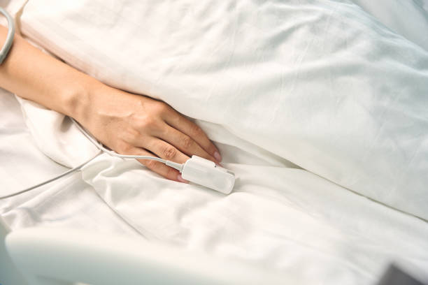 istock Female hand with a diagnostic sensor on the ring finger 1704165142