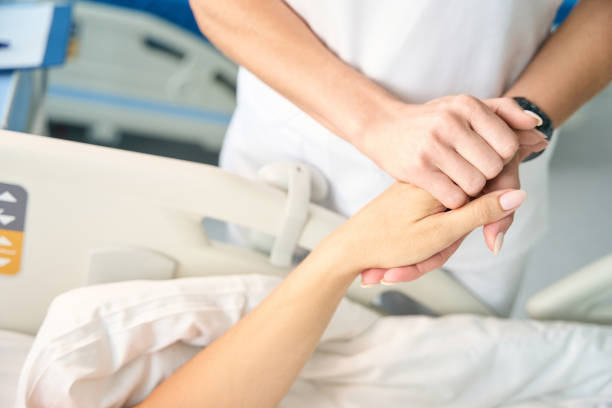 istock Nurse holds the patients hand 1704165144